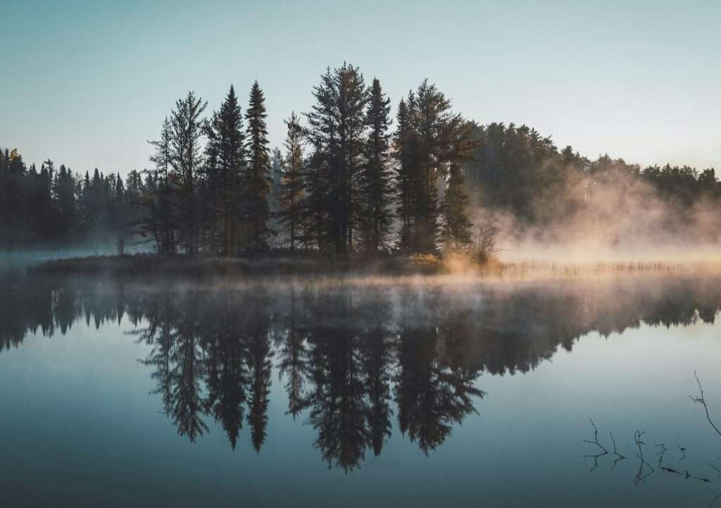 Lake under blue sky during daytime